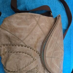 The Sak Tan Crossbody Bag with Peace Sign Curved Stitching